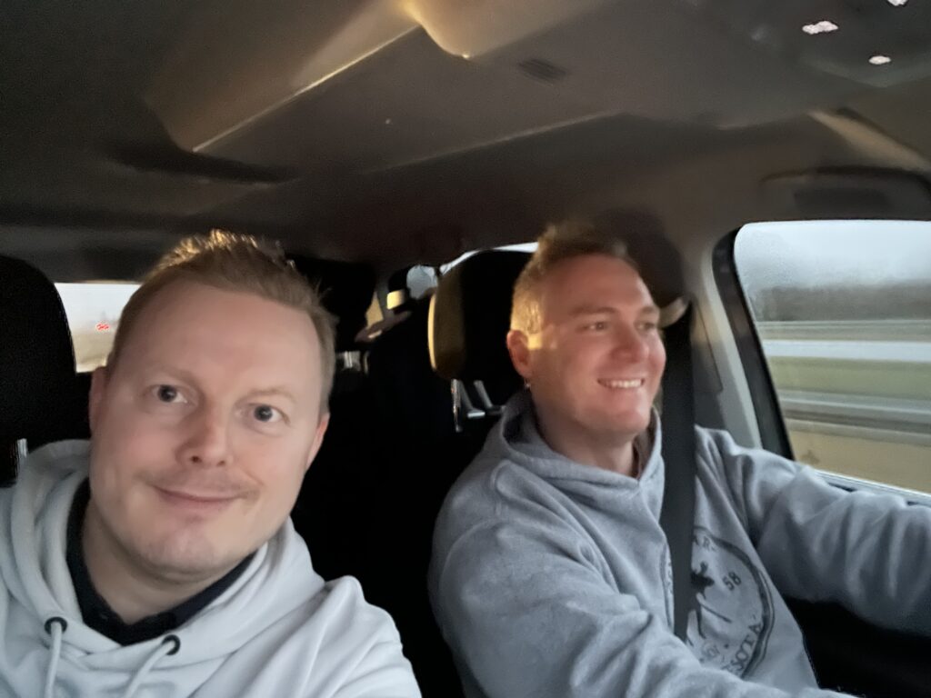 this is a picture of the co-founders of novitio, Anders and anders, in a car. They smile
